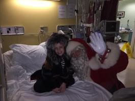 Neveah and Santa share a special moment after the surprise gift was presented to her.